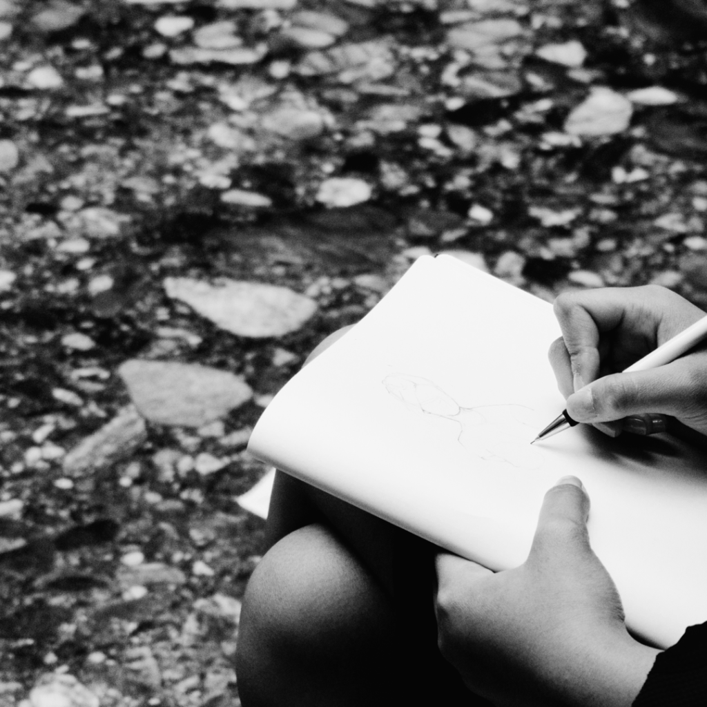 A teenage girl sketches